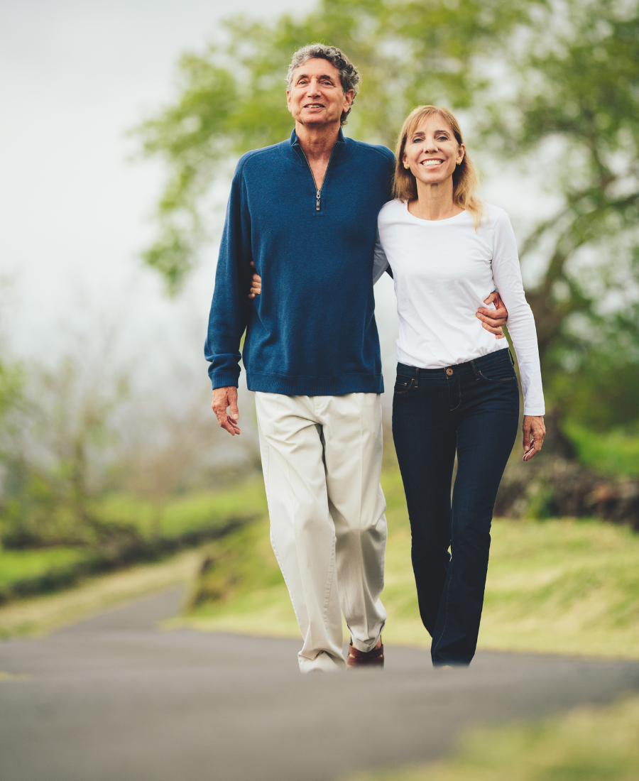 two middle-aged women having coffee on the boardwalk
